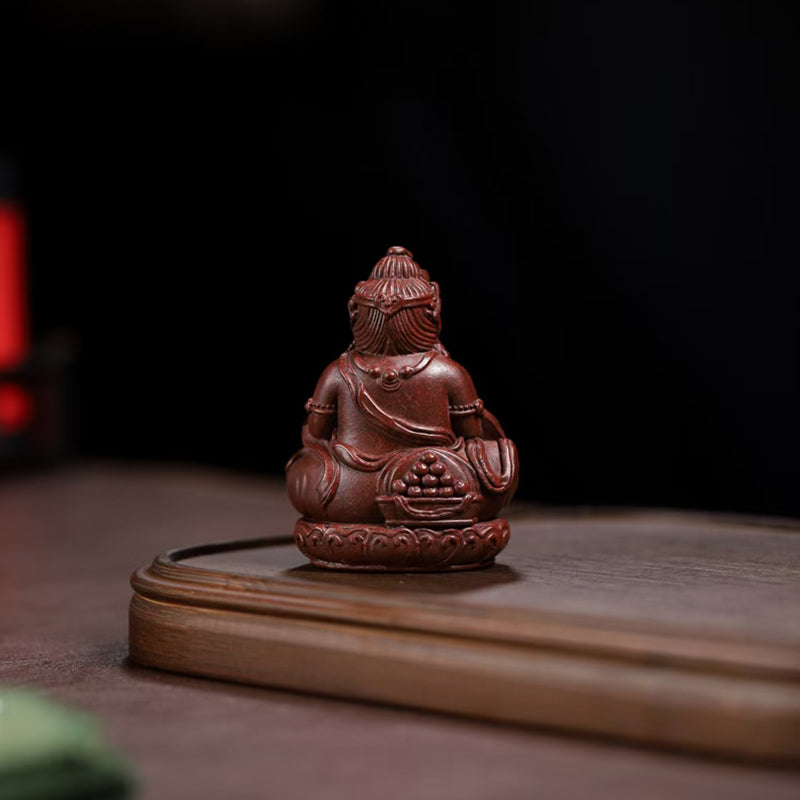 Zi Sha tea pet Cai Shen attracts wealth and treasures.