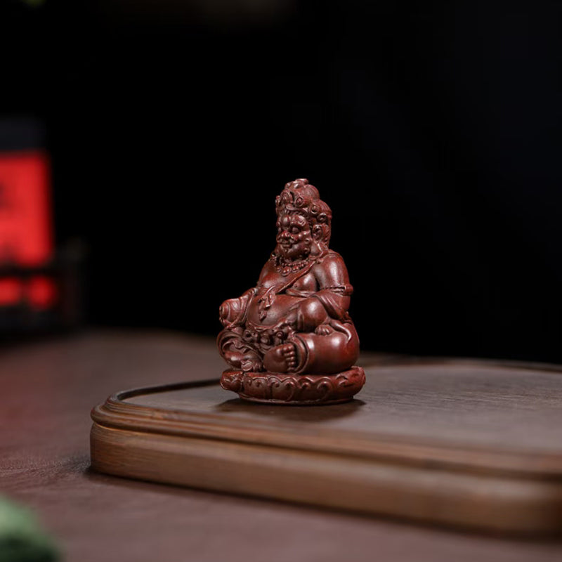 Zi Sha tea pet Cai Shen attracts wealth and treasures.