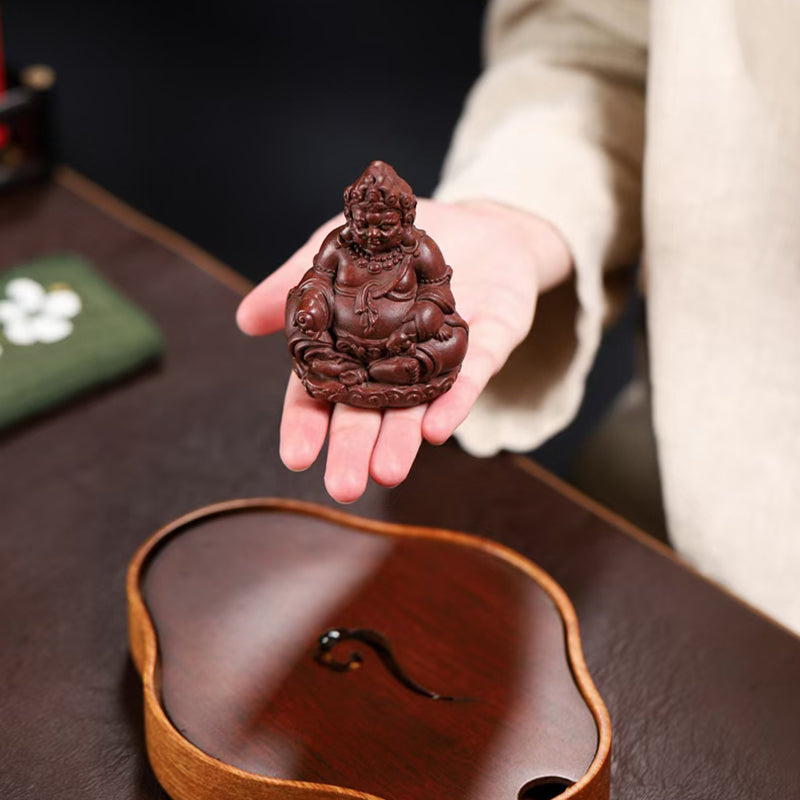 Zi Sha tea pet Cai Shen attracts wealth and treasures.